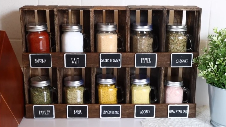 A DIY spice rack made of Dollar Tree items on display in the kitchen.