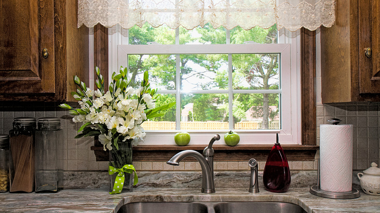 an old-fashioned kitchen with valances over the window