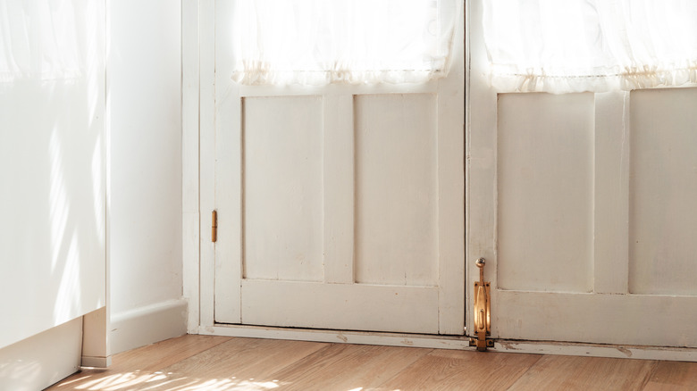 wood door with curtains