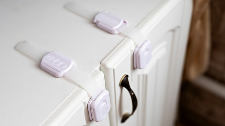 Childproof locks visible on cabinet doors