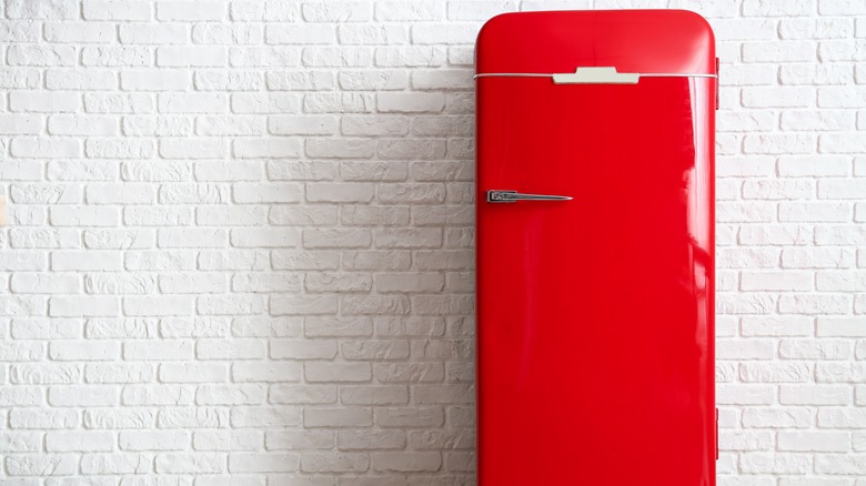 red fridge against white background