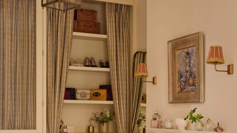 Curtains parting to show open shelving.