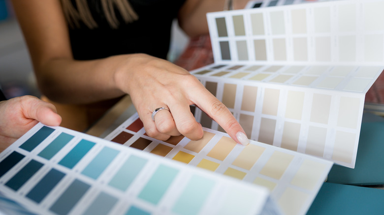 Woman selecting paint samples
