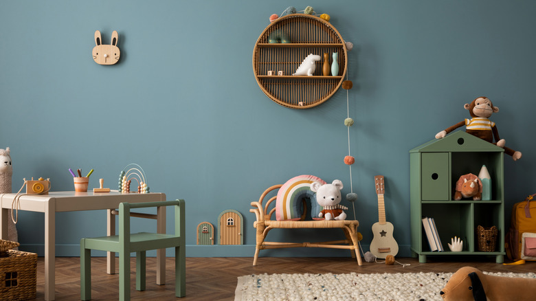 A playroom with a rattan shelf