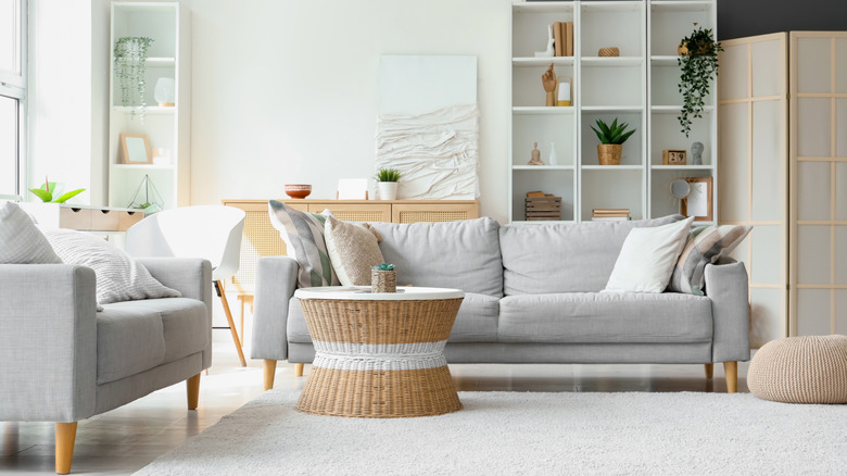 A living area with a rattan table