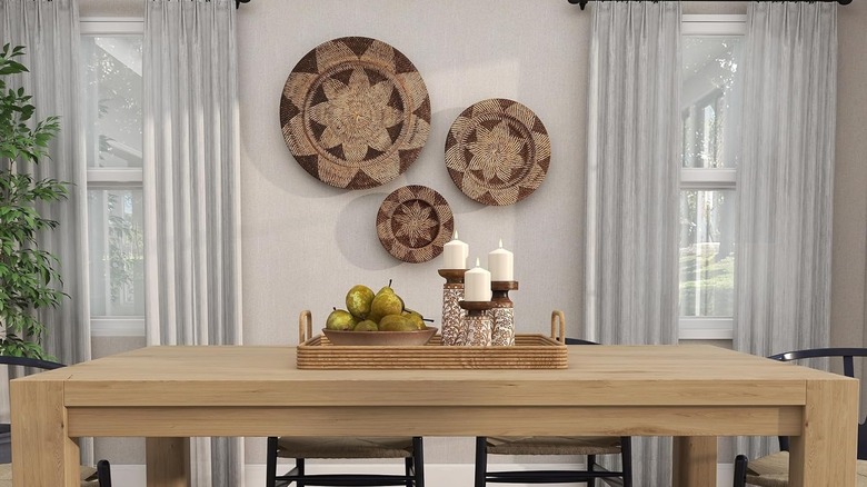 A dining room with rattan wall decor