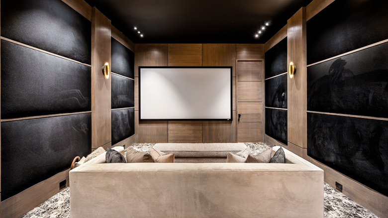 A home theater with the screen on a short wall