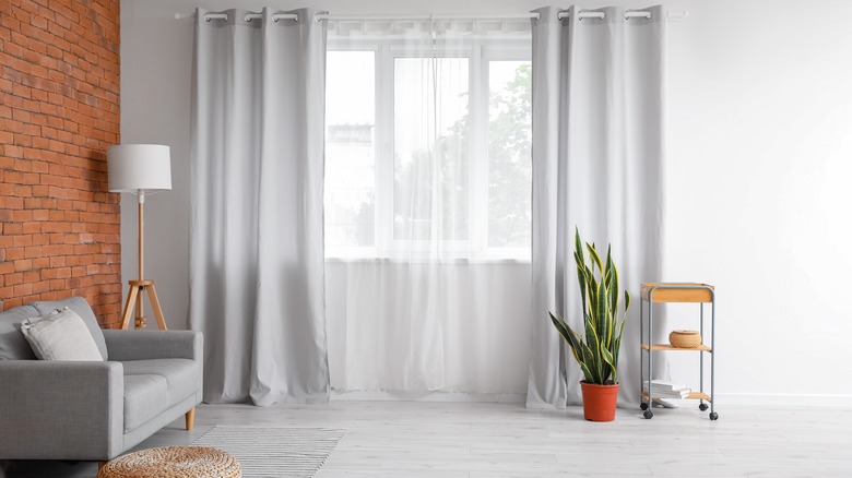 living room with gray curtains