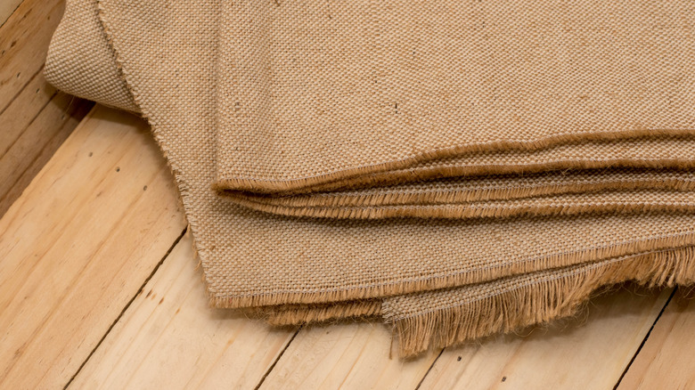 Stacks of burlap fabric.
