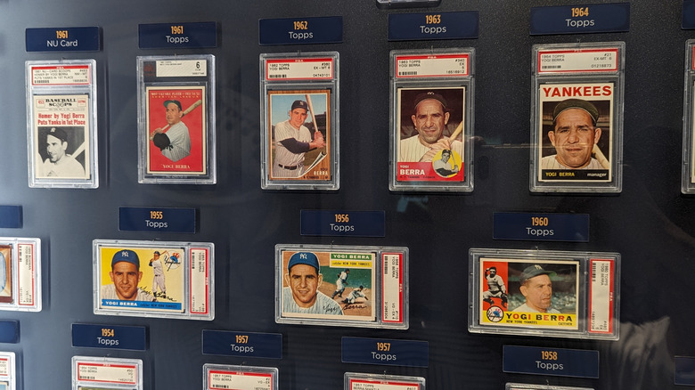 A baseball card collection framed on a wall