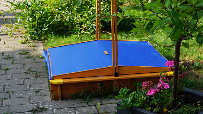 sandbox with cover in garden