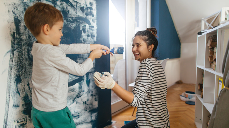 Painting woman and child laughing