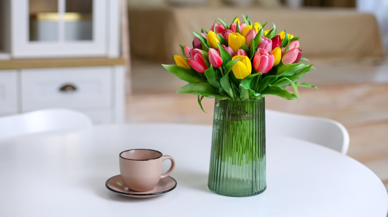 Vase of tulips and mug