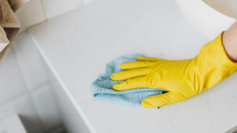 wiping white countertop