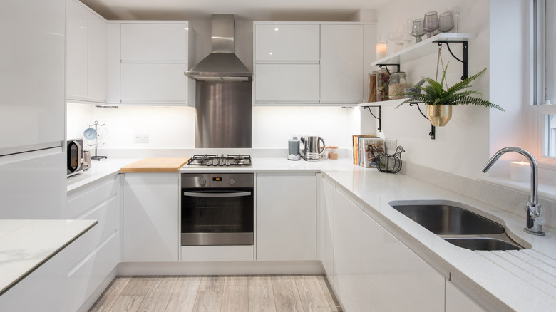 kitchen with white cabinets and countertops
