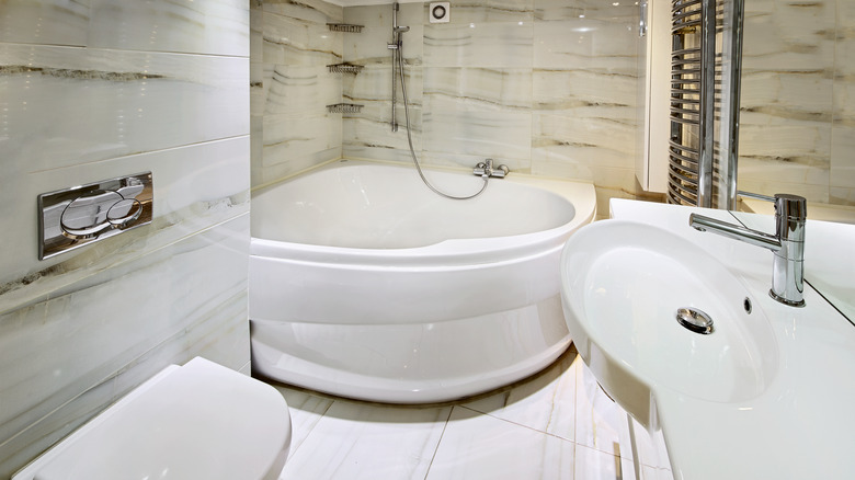 small bathroom with corner tub