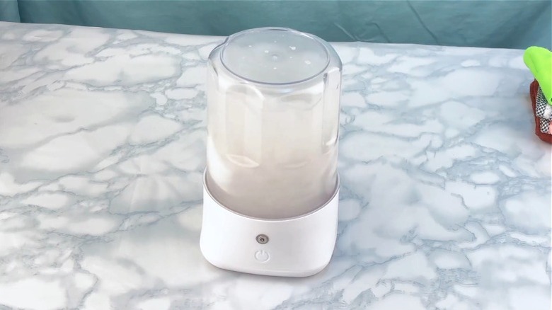 Anbanglin portable washing machine washing clothes on counter