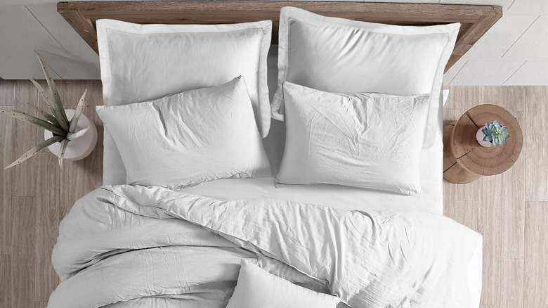 white bed with fluffy comforter