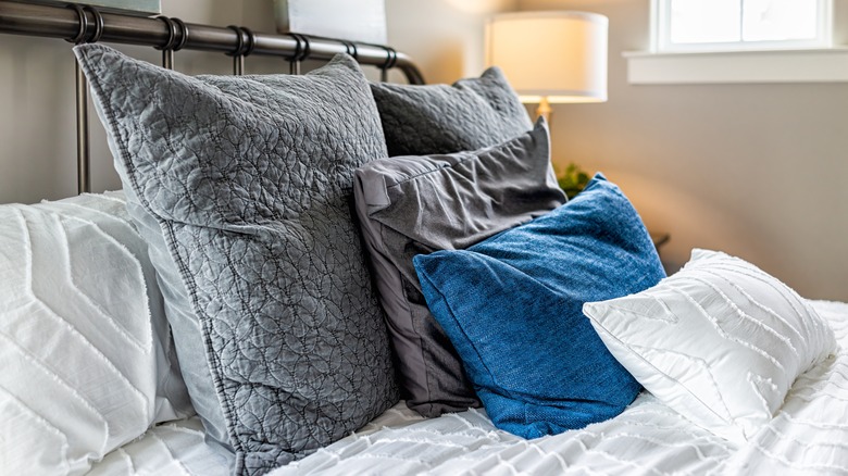 decorative pillows on bed