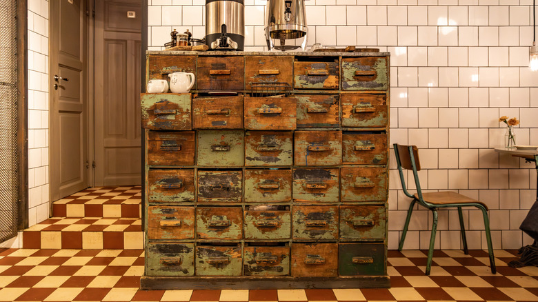 A kitchen with a credenza coffee bar and bright tiles