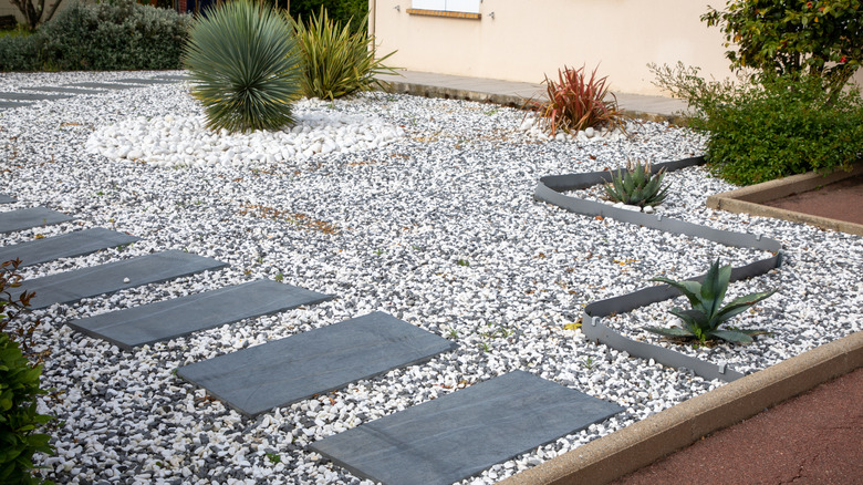 yard with pebbles and paver stones