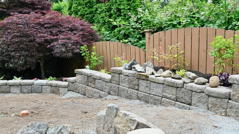 Stone retaining wall under construction