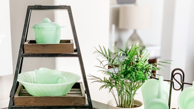 Jadeite dishware on tiered shelf