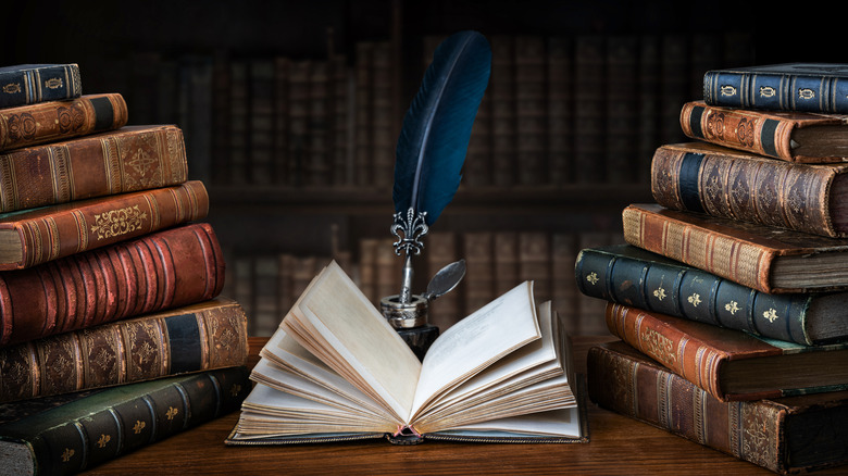 Vintage books and feather