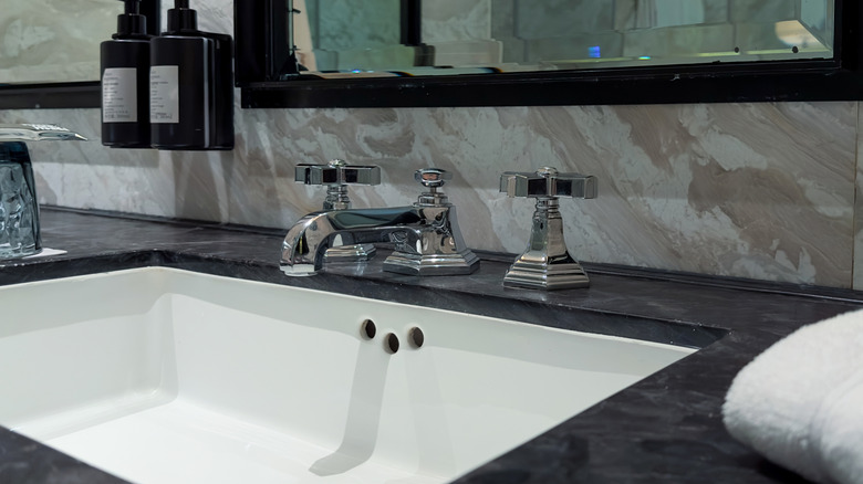 A modern luxury sink with two faucets