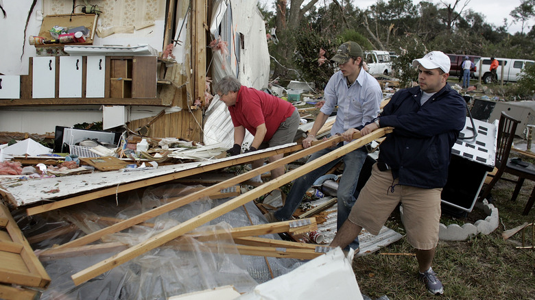 People rebuilding after a natural disaster