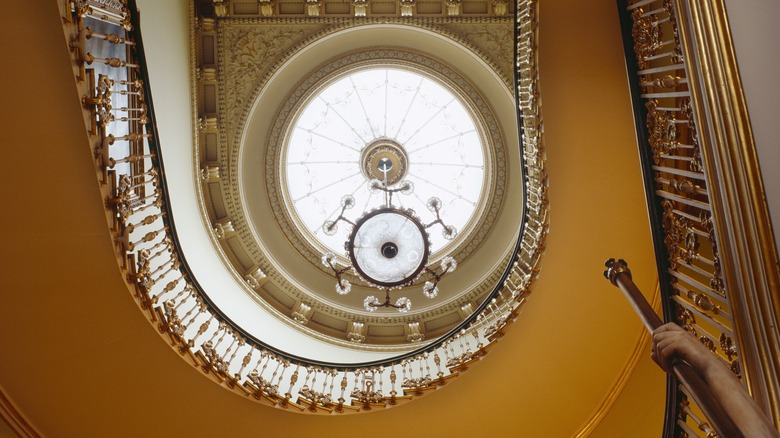 Staircase with gold ceiling