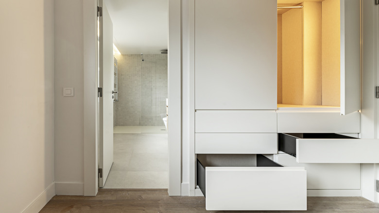 Bedroom with built-in dresser and wardrobe