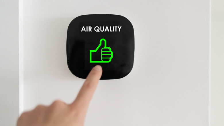 Person using air quality system