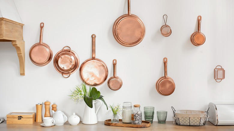 pots and pans on wall