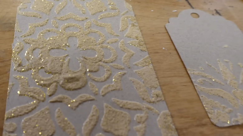 a stenciled gift tag using a DIY metallic paste