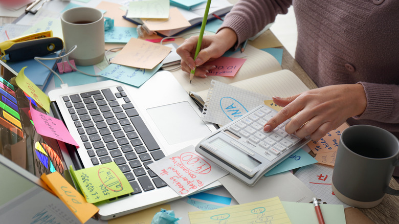 messy desk with papers and notes