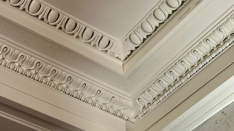 Decorative crown molding with inlaid designs