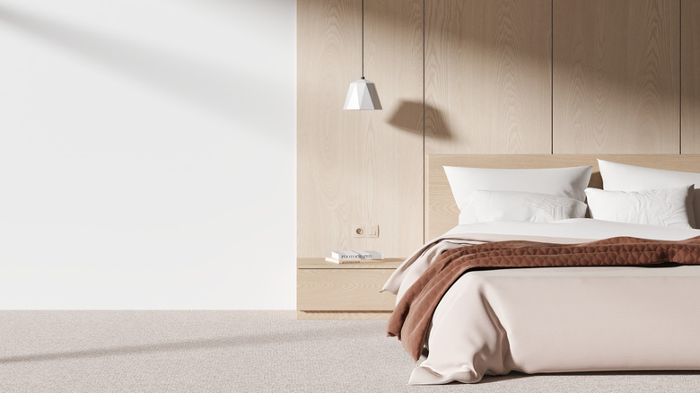 modern minimalist bedroom with carpeted floor