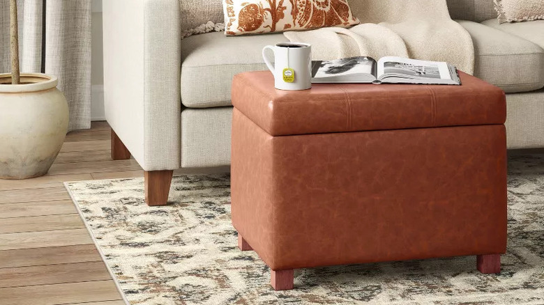 A living room that features a storage ottoman from Target