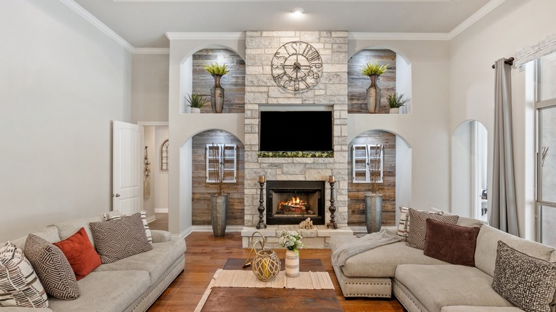 Living room with whitewashed fireplace