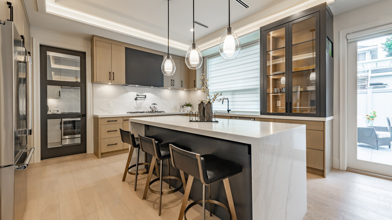 Kitchen with wood, marble, and metal details