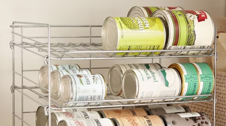 A gravity can feed with various cans