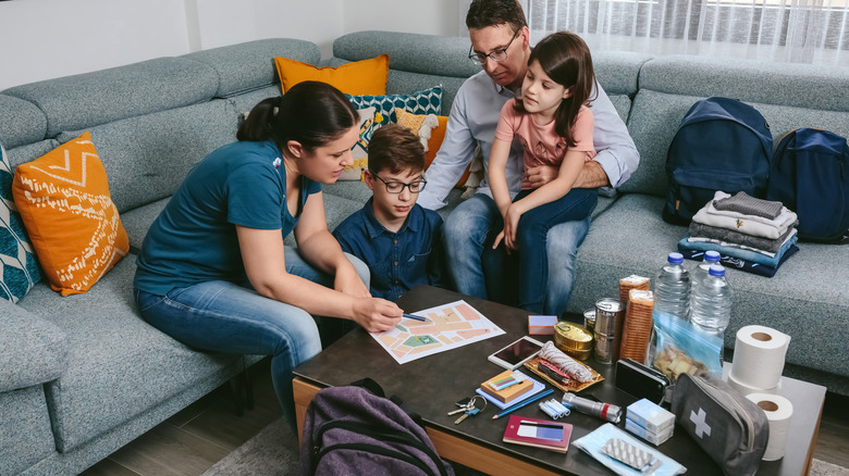 Family organizing emergency supplies