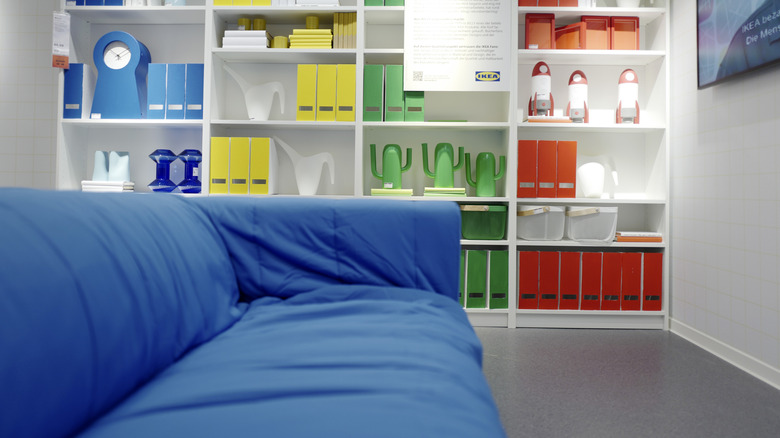 a white IKEA BILLY bookcase filled with colorful decor
