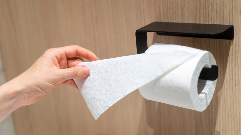 Touching toilet paper