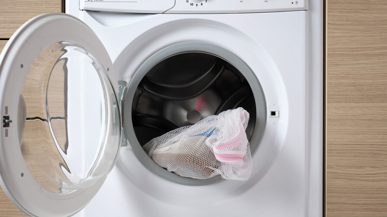Close up of clothing in washing machine at laundromat