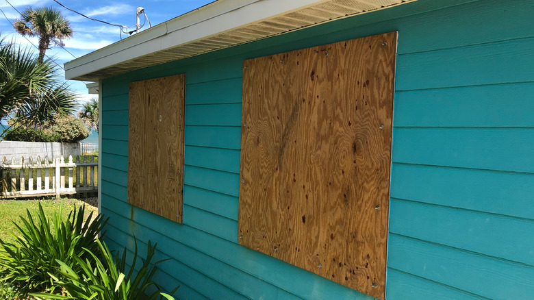 house with boarded windows