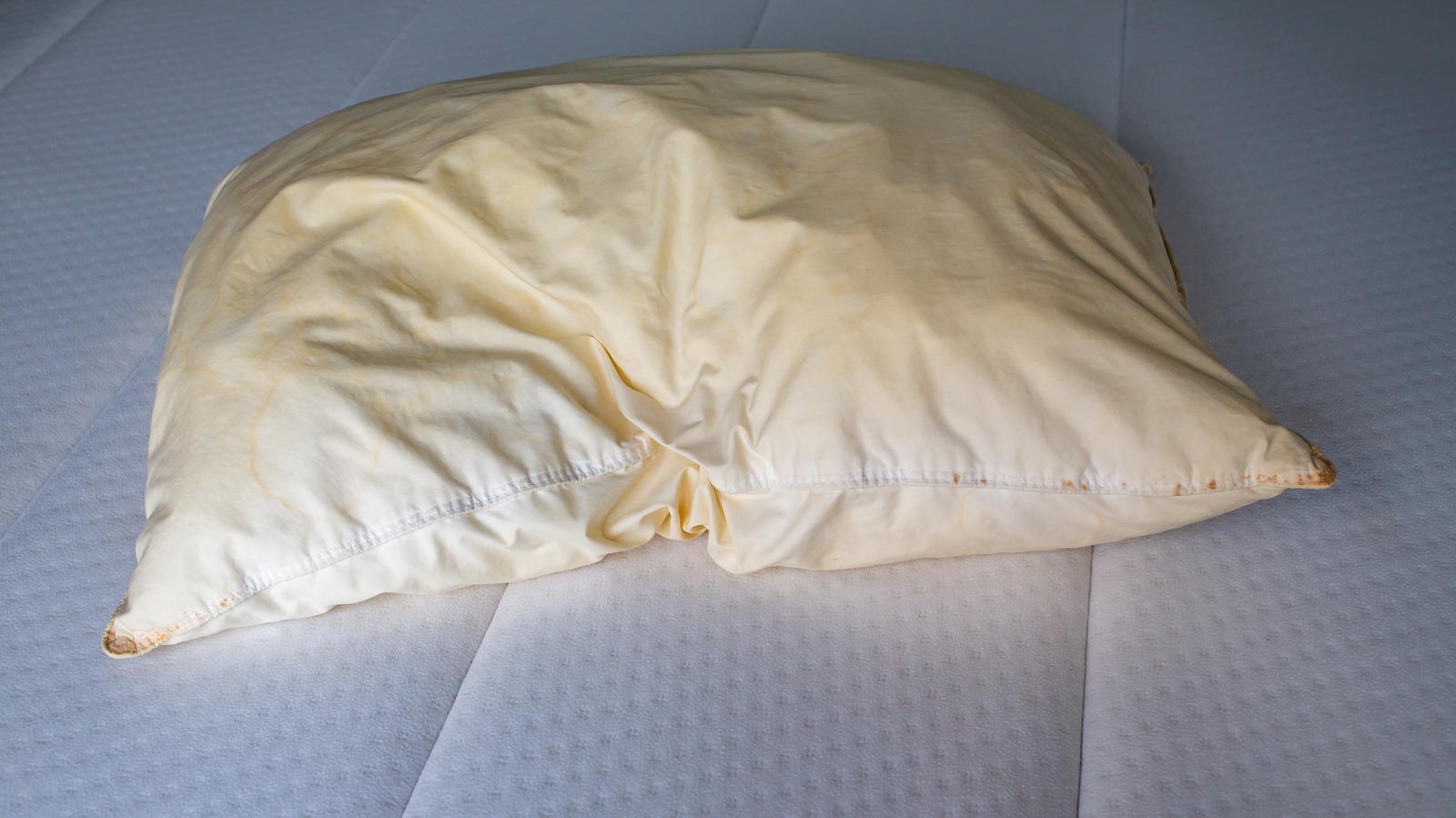 How To Properly Dispose Of Pillows That Might Be Too Far Gone To Donate