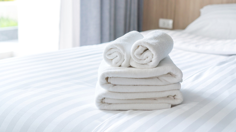 folded towels on a bed