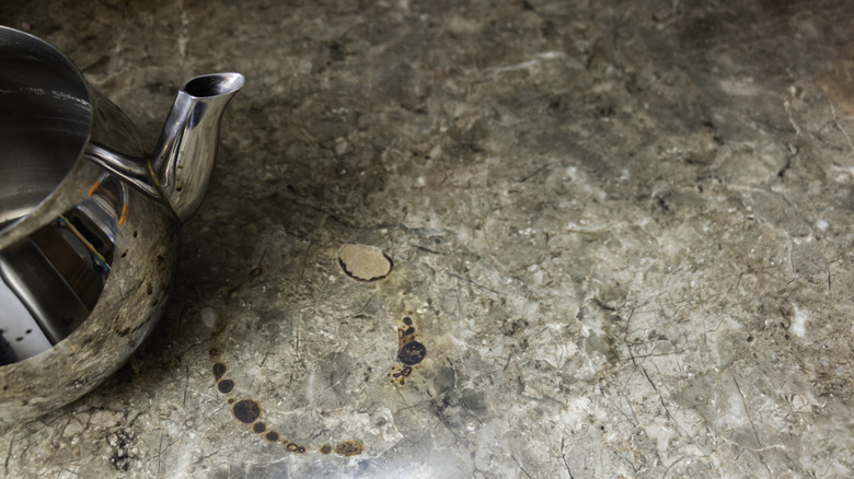 A granite countertop that has been damaged by a kettle